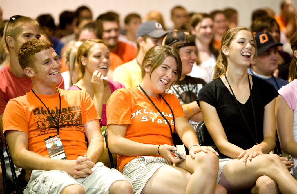 A classroom of OSU students smiling and laughing with the presenter