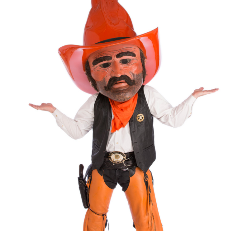 Pistol Pete is standing and putting his hand out in an I don't know manner