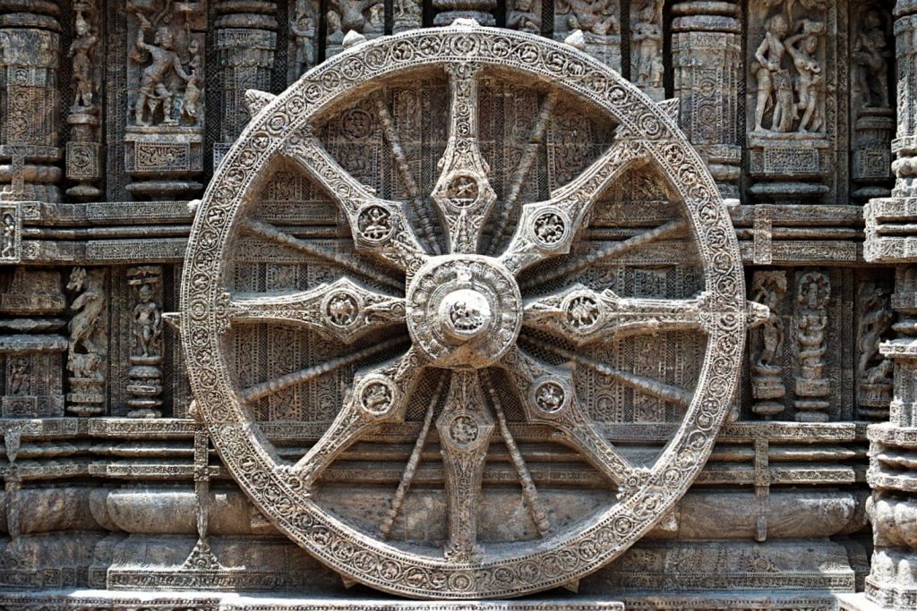 A stone carving of the eight-spoked Dharma Wheel.