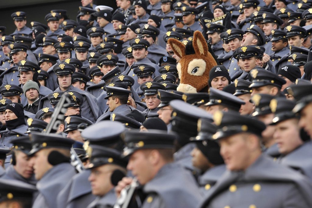 A stuffed donkey surrounded by people in police-style uniforms