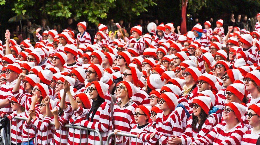 Crowd of people dressed in red and white striped clothes